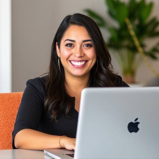 Maria Rodriguez, Community Manager at FuelWise, working on a laptop.